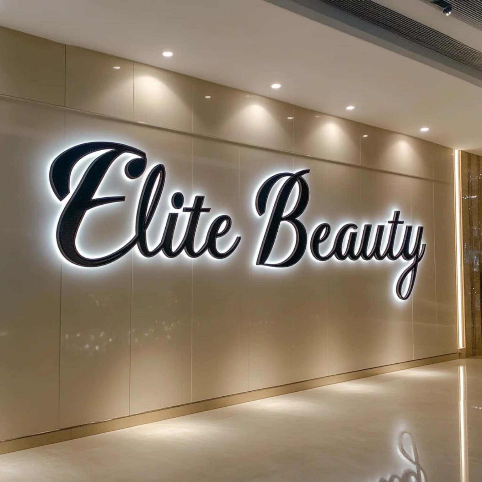 Black script dimensional letters with bright white halo lighting on a salon wall